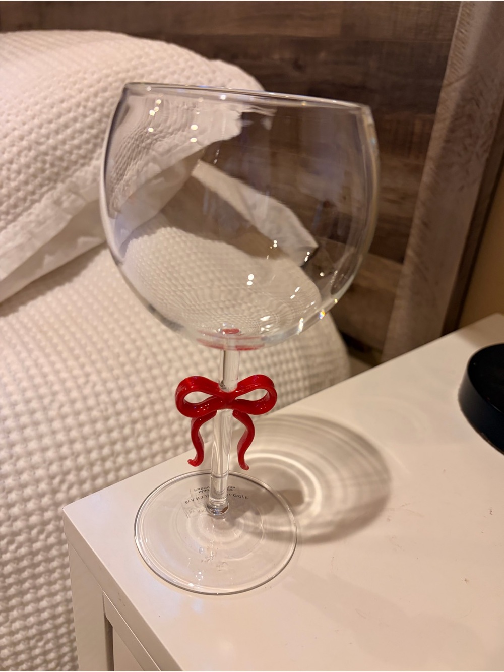 Anthropologie Wine Glass with Red Bow Accent, four total.